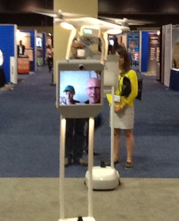 CFM drone checks out #suitabletech Beam Pro robot in Museum Expo at #AAM2014 . The future looks at the future.