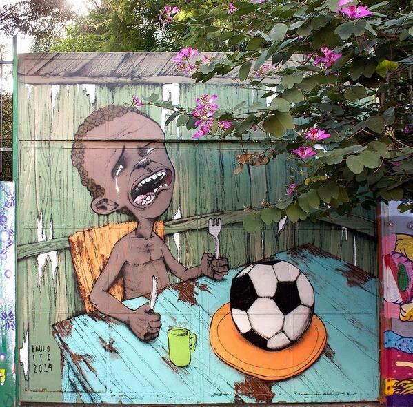 The World Cup begins soon and Brazilian street artist Paulo Ito has painted a powerful mural on the side of a school