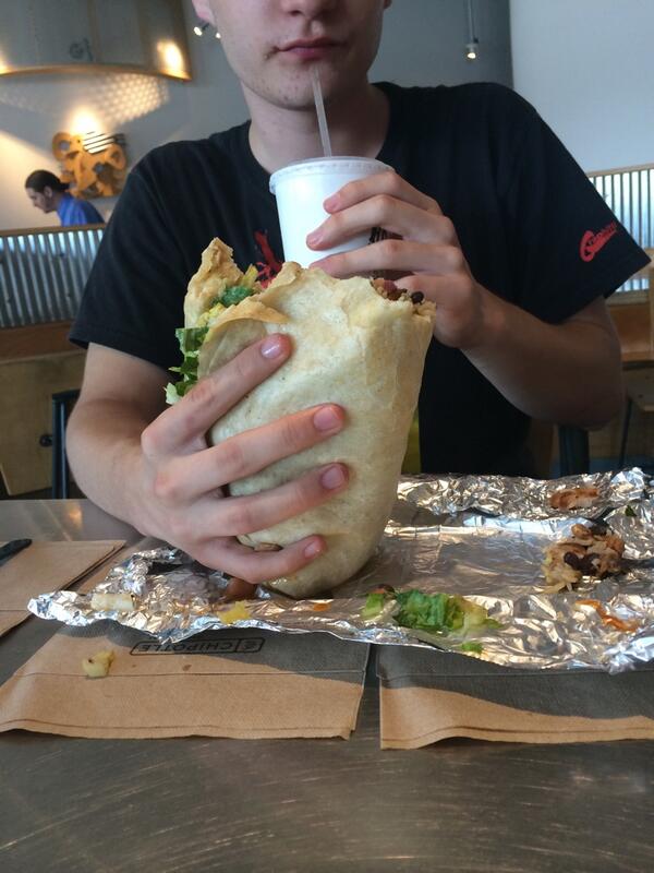 brainconti's tweet photo. Stew got a Quesorrito from chipotle and he is it comparing to a rugby ball. http://t.co/kfoj02UCiY