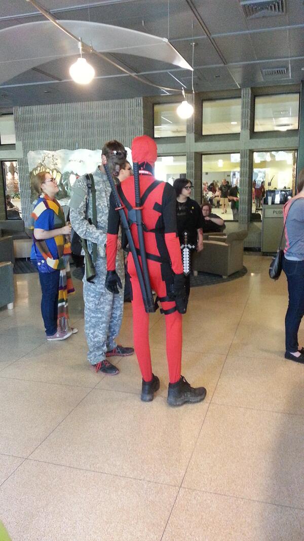 Fox28_Spokane's tweet image. Deadpool and friend getting espresso. #caffeine #spokanecomicon $1 off entry with can off food. @ S.C.C college
