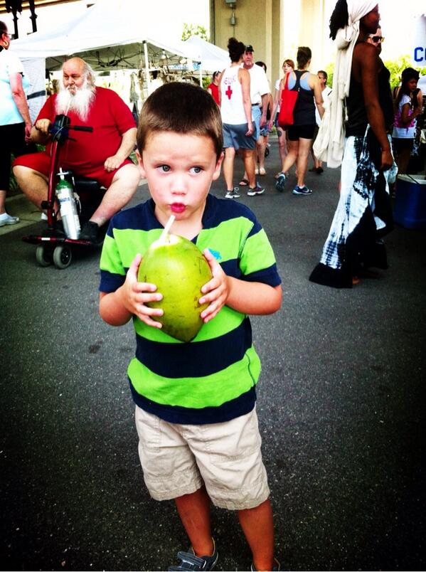 Fresh coconut milk and a photobomb from Santa. #RiversideArtsMarket #jax