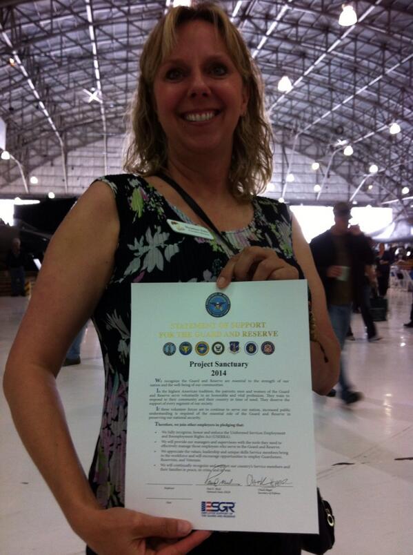 Our Executive Director holding the certificate @ProSanctuary just received from @CO_ESGR!