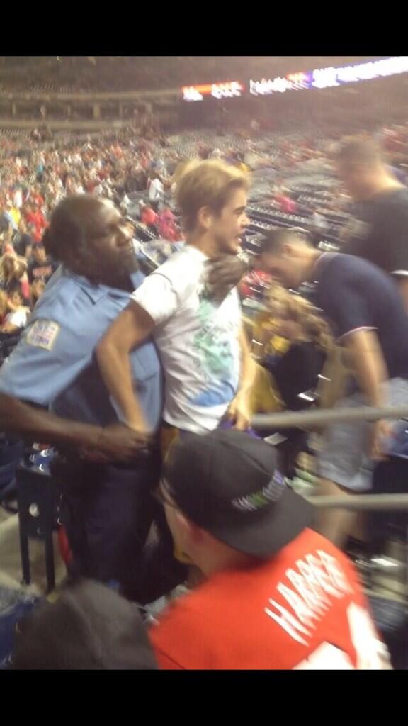 BeMy_VaIentine's tweet photo. Gonzaga kid being taken out of the stadium after running onto the field. That's what it's all about boys #Hail http://t.co/U8K6TiES8A