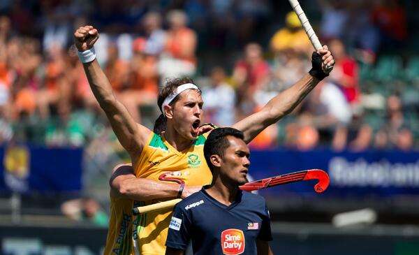 FIH_Hockey's tweet photo. #RHWC2014 #MASvRSA - contrasting emotions as @JustinReidRoss celebrates his hat-trick in the 11-12 classification http://t.co/wIYnJMbEV1