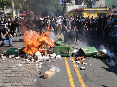 Blockupy_NRW's tweet photo. RT @StopMotionsolo: Trash burns in the street at an anti-cup protest in São Paulo, Brasil. #FIFA #NaoVaiTerCopa http://t.co/QHB7biq2IO"