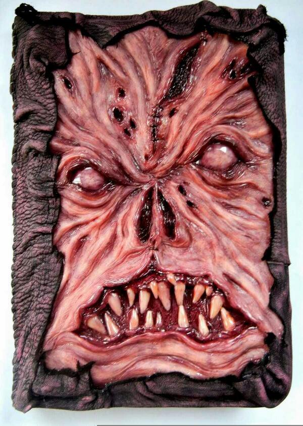 Spangle_Pimp's tweet photo. Some people find Jesus in toast, I found this. The cover of the #Necronomicon (Evil Dead) in a cake.
 @GroovyBruce http://t.co/2i9dFG4M8P