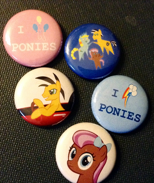 ponyconMLP's tweet photo. Buttons for fans of the ponies - Try not to look too long at Mascot Bowtie #Ponycon #ConStore http://t.co/442Uv7Sd3K