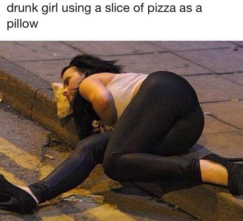 Drunk girl using a slice of pizza as a pillow