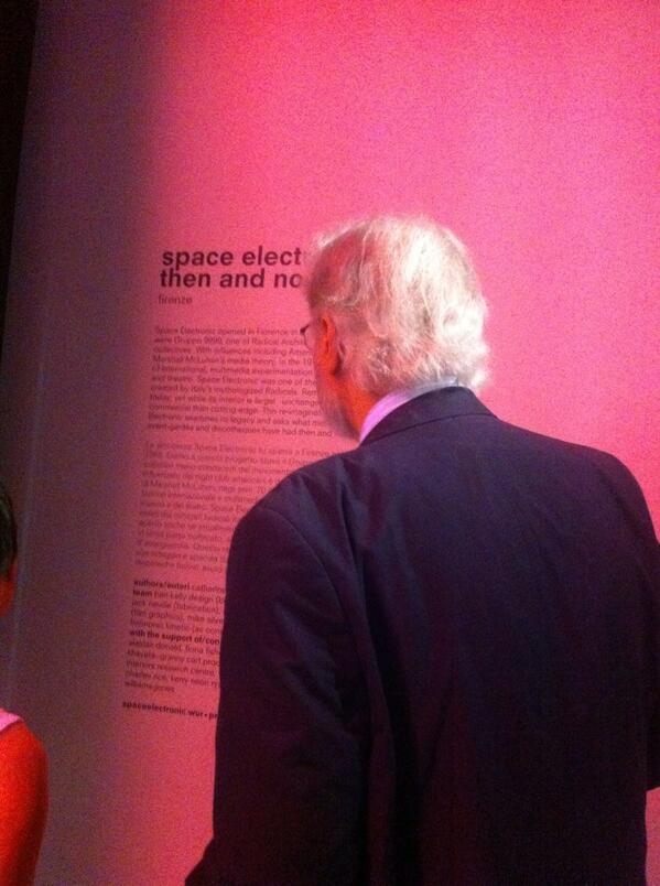 cat_rossi's tweet photo. Gruppo 9999 architect Carlo Caldini at #spaceelectronic @monditalia bathed in pink neon glow http://t.co/PpSWo3b3La