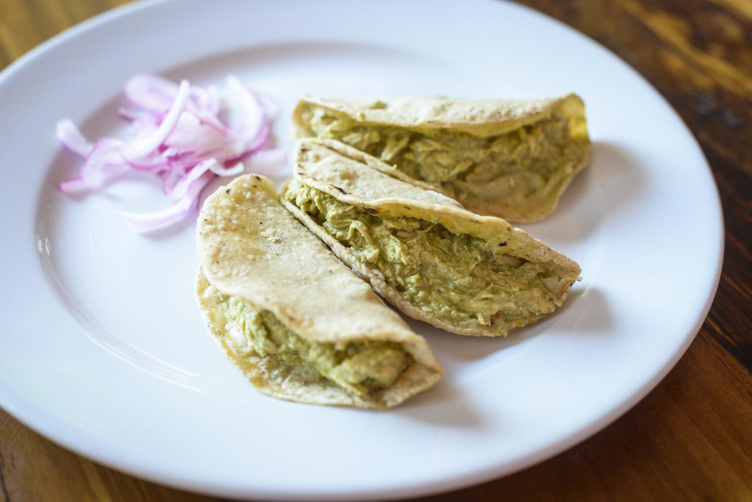 Discover the Rich Flavors of Tacos de Mole Verde at Hotel Las Palapas