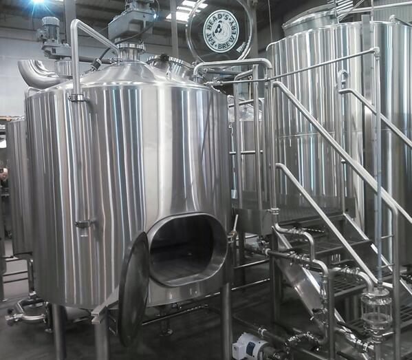 Matt's at JVNorthwest inspecting our shiny new brewhouse for our upcoming Portland Brewpub @FatHeadsPDX