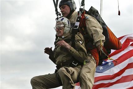 NewsBreaker's tweet photo. AWESOME!: 93-year-old veteran makes tandem parachute jump onto Utah Beach in France to mark D-Day Anniversary (@AP) http://t.co/Tn12HSmKre