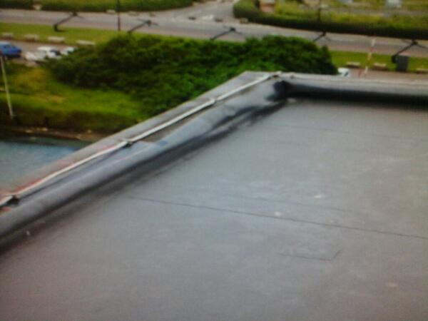 The whole of the membrane has now pulled out of the detail not looking good and starting to leak.