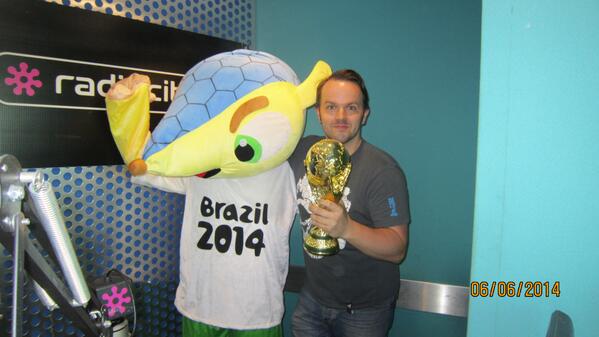 Simon Greening meeting World Cup Brazilian Mascot ''armadillo' St Johns Market <a href="/RadioCity/">Radio City</a>  FREE photos today.