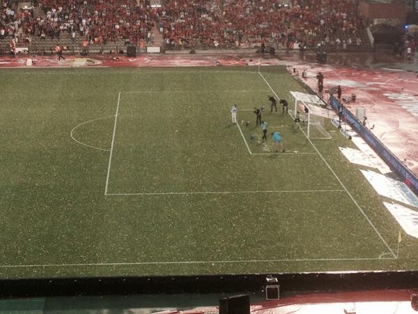 Brussels football stadium looking like a practice golf course... after heavy snowy rain shower...