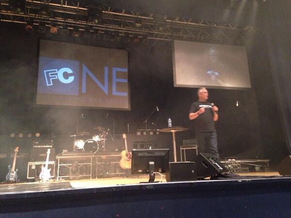 GinaElmes's tweet photo. Andy preaching on celebrating new life and 52 people getting baptised in a moment #FCONE http://t.co/BYeYWtggvX