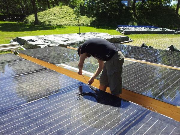 teamDTU's tweet photo. Working under/for the sun! 
Final connections of the PV panels of our weather shield #SDE2014 #SolarDecathlon http://t.co/ilj6O7o8Km