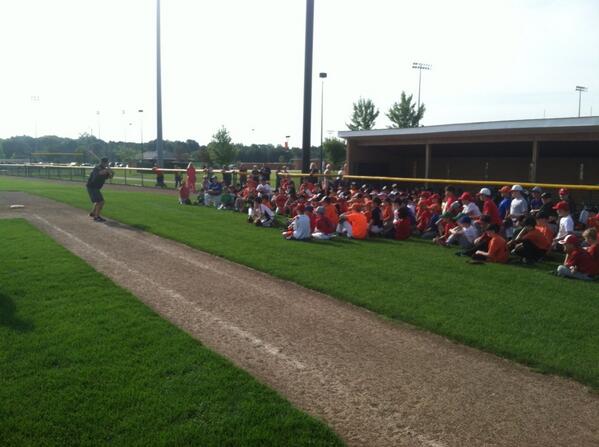 A great morning for baseball. It is Tiger Baseball Camp time.  Coach Funkhouser instructing the campers on hitting.