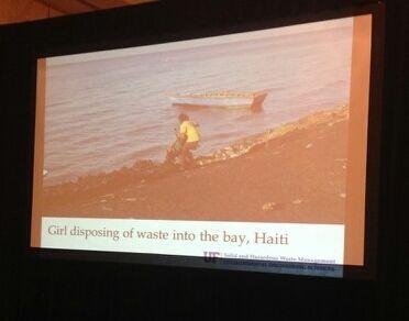 Girl disposing of waste into the bay, Haiti. Max Krause. Photo Tim Townsend, UF. #GlobalWaste #GWMS