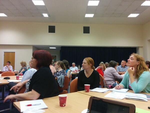 People listen intently to Nick Andrew.'s presentation