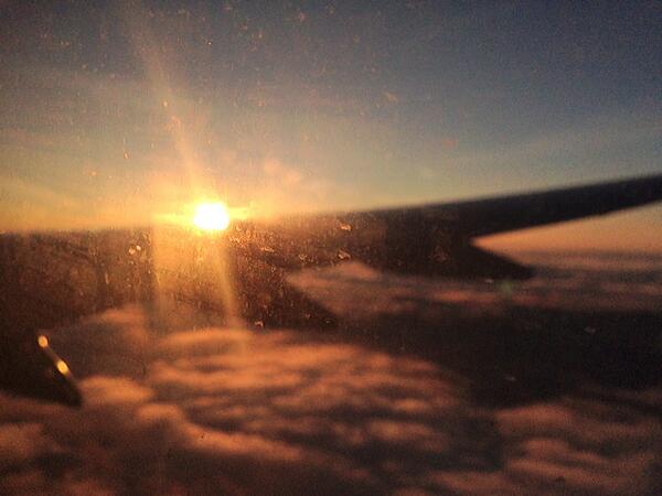 tompilk's tweet image. Beautiful sunset above the clouds... Nicely focused on the mucky window  ;( #GiveEmACleanRyanAir #PilksInAfrica