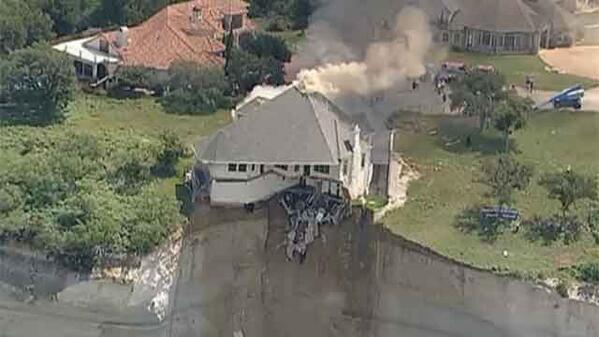 fox5ny's tweet photo. Watch #LIVE as house on edge of cliff in #Texas set on fire by demo crew: http://t.co/3RCdtV1LJu #MyFoxDFW http://t.co/n18ea1dwcr