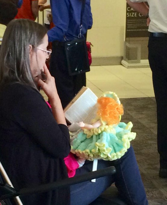 Has anyone else ever experiences a woman reading to her doll at the airport? #travelproblems @dmodaguide<a href="/tag/travelproblems"class="tags"><span>#travelproblems</span></a>