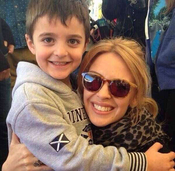 kylieminogue's tweet photo. Met this little guy whilst filming at the flower market 2day. He bought #teamkylie cupcakes!!! 💜thank u! http://t.co/U730VsPMYl