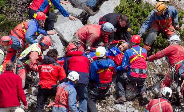 BBCWorld's tweet image. Injured German caver trapped underground for 12 days brought to surface after rescue operation bbc.in/1oJOasW