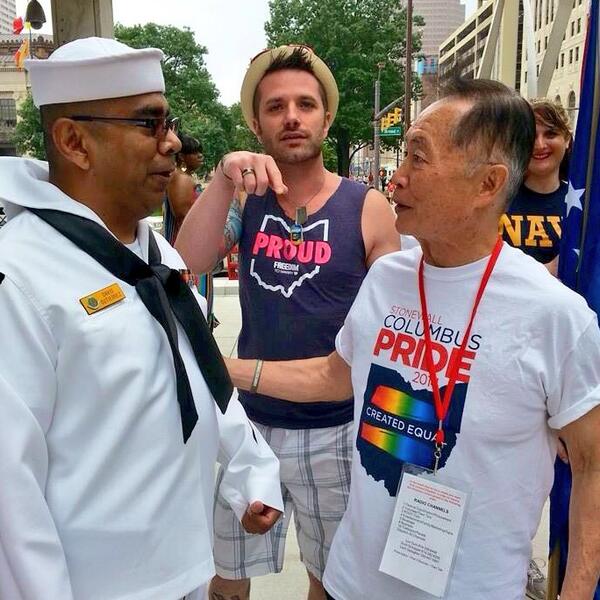 George Takei meets Navy Vet David Gutierrez as Josh Snyder-Hill moves George thru the crowd.