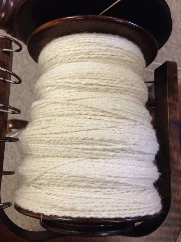 An almost full 8oz bobbin of English Angora bunny & Cormo wool blended laceweight yarn. #yarn #donetherightway