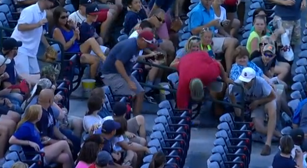 A fan wanted a foul ball so badly that he comically flipped over a ...