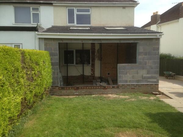 bellanhurst's tweet photo. Rear kitchen extension, shallow pitch roof tiles on, ready for windows and doors and render http://t.co/9bsp5YjyRI