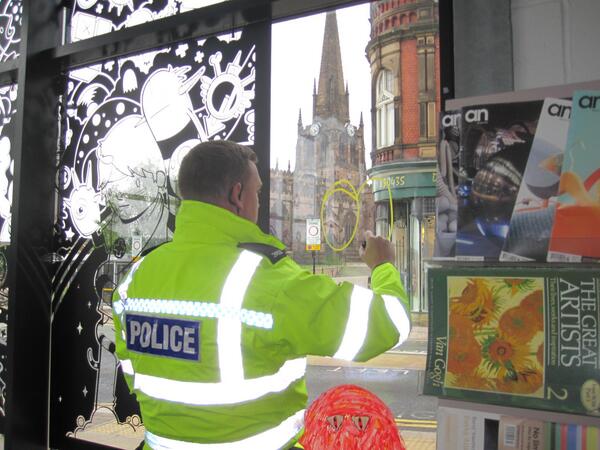 SallyBimpkins's tweet photo. @OpenMindsTC great window display, love that police got involved with the arts community! (bloody graffiti artists) http://t.co/AbLcKVyZx7