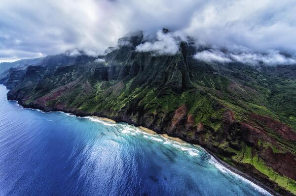 Na Pali Coast, Kauai, Hawaii. Taken from an open door helicopter by Keith Manning