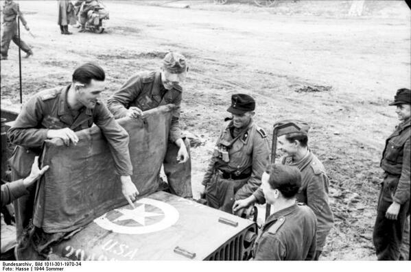 HitWithHistory's tweet image. German soldiers with a captured American jeep, Northern France Summer-1944