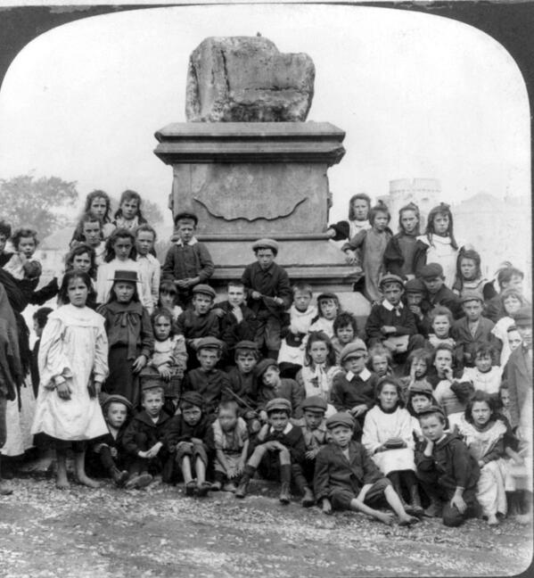Limerick1914's tweet image. Children pose for a photograph by the Treaty Stone (1903) #Limerick (via @librarycongress)