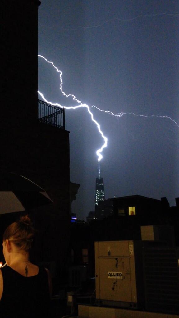 Gerick's tweet image. Just watching the lightning hit 1 WTC from a NoHo rooftop.