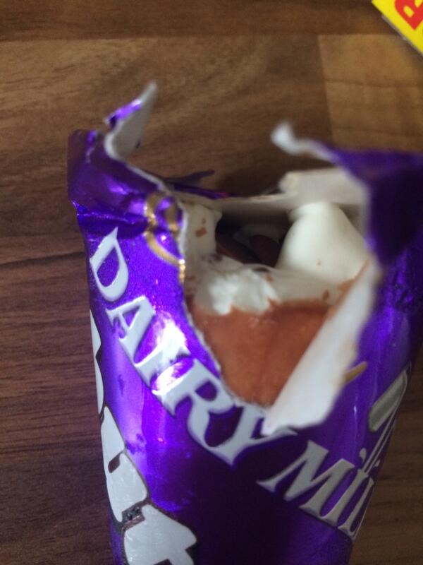 Just opened a box of Dairy Milk buttons ice creams to find this! An open wrapper and two teeth marks!! <a href="/CadburyUK/">Cadbury UK</a>