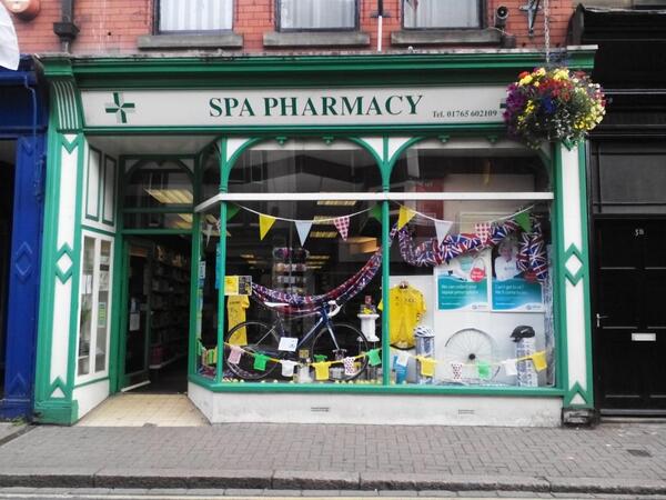 cet2203's tweet photo. @StrayFM Spa Pharmacy Tour de France window #tdf #ripon http://t.co/9w1dEhwDtp