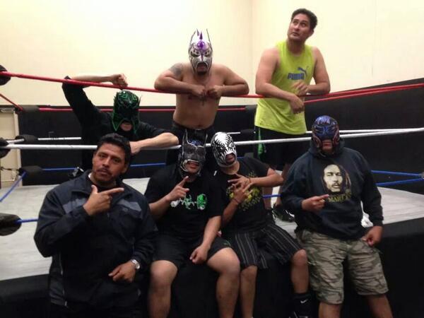 That me in the green . Looking at a bug on the wall