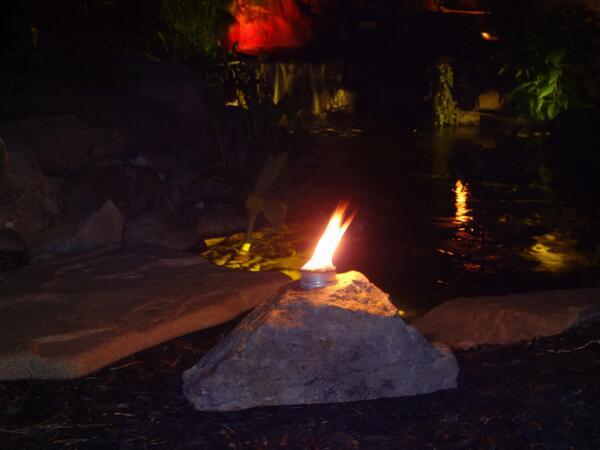Pictures of our Fire Boulders at night. With the citronella burning inside kept the bugs away all night.