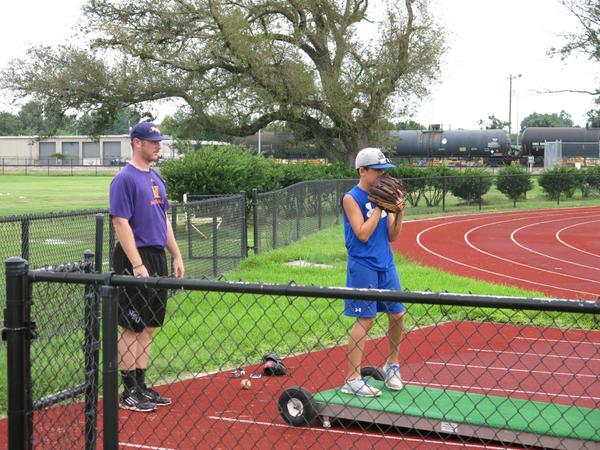 BaytownBaseball's tweet photo. Former GCM star and Northwestern St. Pitcher Cody Butler coaching up Asher http://t.co/gTUPMDLj3c
