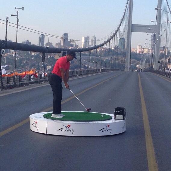 OMGFacts's tweet photo. Here's Tiger Woods about to hit A Golf Ball From Europe Into Asia http://t.co/j7kEo7CYx2