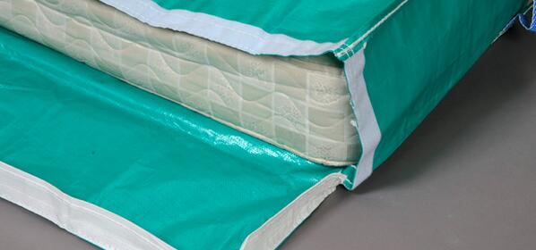 Store mattresses and box springs on long edges. Wrap for protection and elevate off of the floor.
