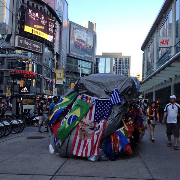 Min90TO's tweet photo. This guy will certainly miss the World Cup! #DundasSquare #WorldCupTO http://t.co/o0FPOnTrVl