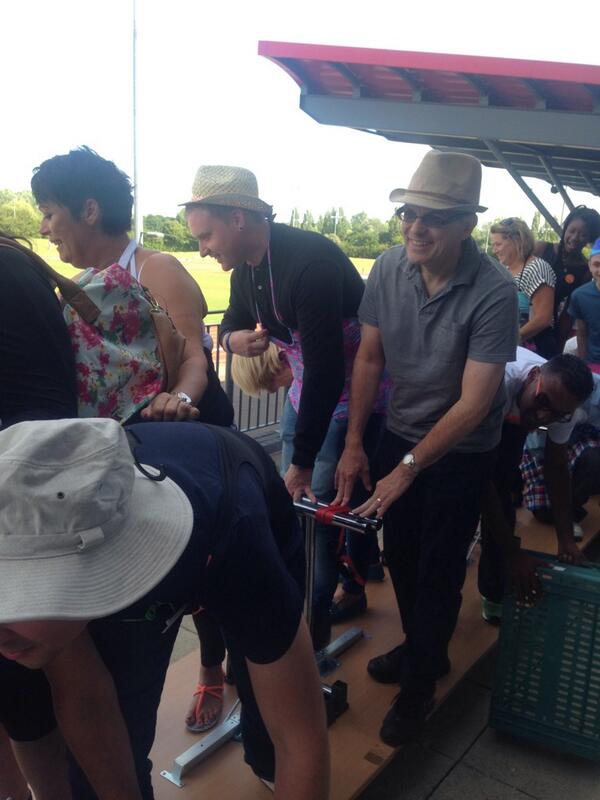 Only the Basildon Team could make a boat out of upturned tables on blue dolly wheels with green trays as paddles !!