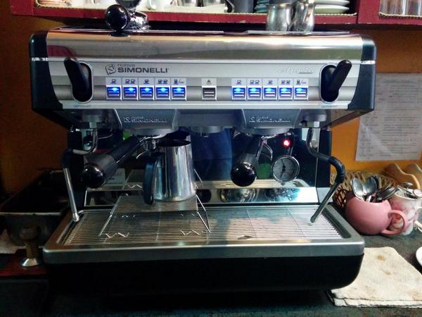 Come in from the rain and grab a hot drink from our brand new espresso machine! #shiny