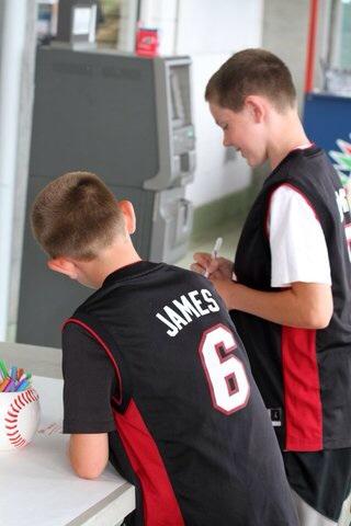 My boys are signing a thank you card for Lebron James, from the Fort Myers Miracles.  See you in Cleveland!