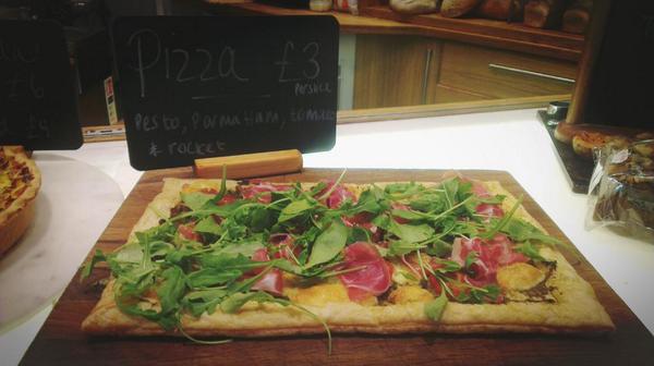 Fancy a slice! Tomato, mozzarella and pesto pizza with parma ham and rocket!